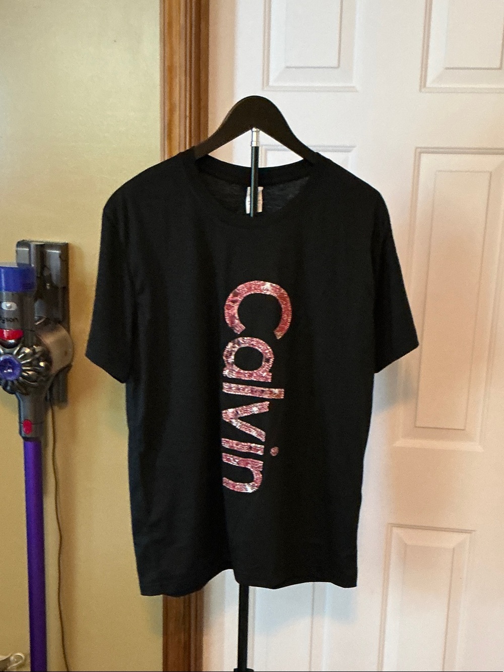 Calvin  Black T‑Shirt with Metallic Pink Vertical Logo